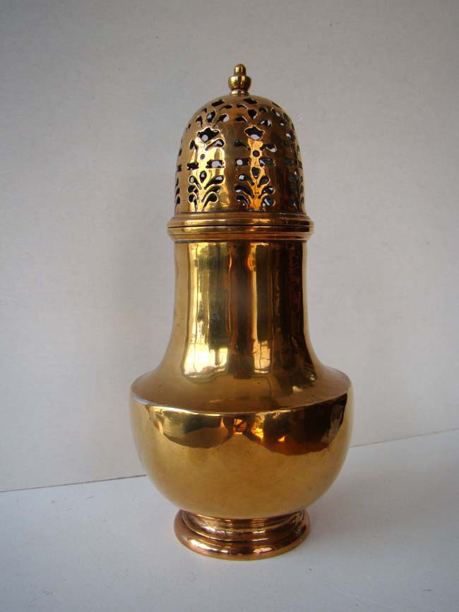 A fabulous early 18th century bell metal muffineer or sugar shaker circa 1720.